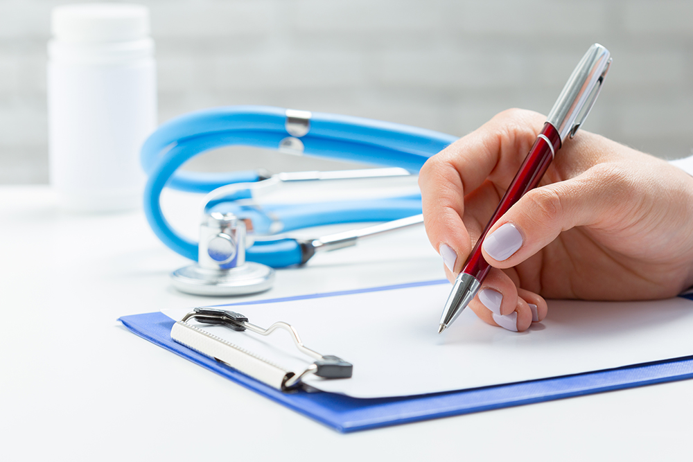 the doctor writes a prescription pil