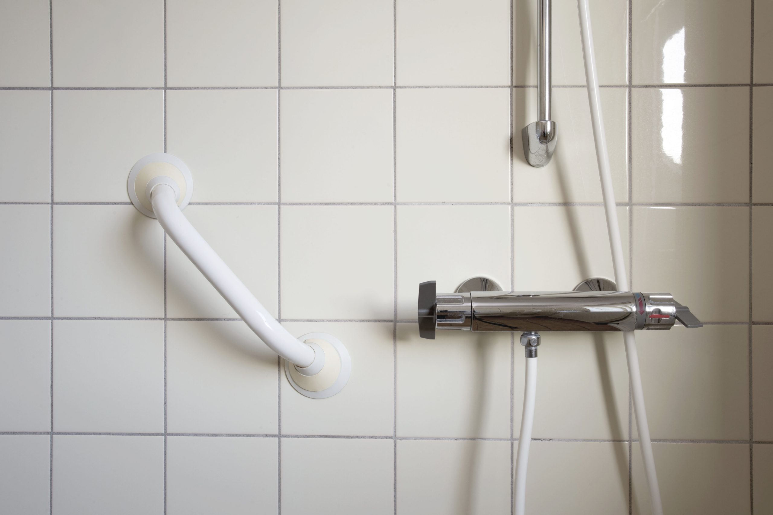 Shower and handrail,grab bar for elderly people at the bathroom in hospital or retirement home , safty and medical concept