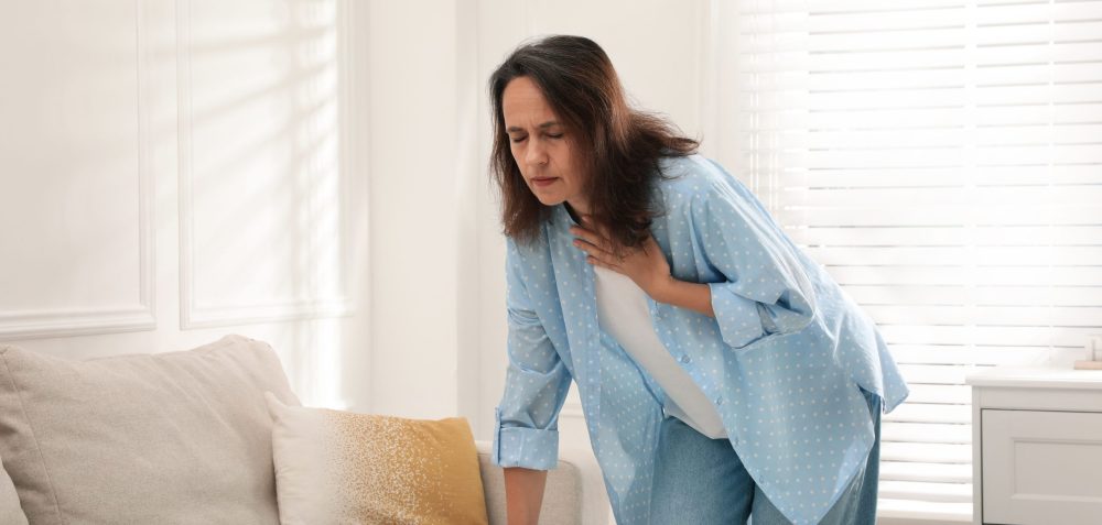 Mature,Woman,Suffering,From,Breathing,Problem,At,Home