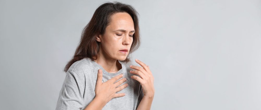 Mature,Woman,Suffering,From,Breathing,Problem,On,Light,Background.,Space